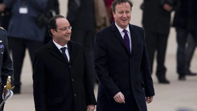 Hollande, Cameron visit Paris concert hall that was attacked Hollande, Cameron visit Paris concert hall that was attacked