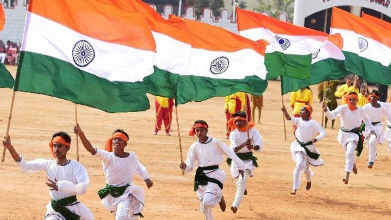 Students carrying the National Flag while performing during the 68th Republic Day celebration at Manek Shaw Parade Ground in Bengaluru on Thursday. (Photo: PTI) Republic day, national flag, India