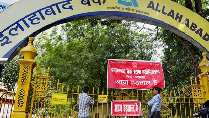 A security guard stands outside a bank branch that was closed during the bank employees' two-day nationwide strike to press for wage revision, in Allahabad on Wednesday, May 30, 2018. A security guard stands outside a bank branch that was closed during the bank employees' two-day nationwide strike to press for wage revision, in Allahabad on Wednesday, May 30, 2018.