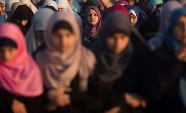 Minister's hate speech about Muslims liable for prosecution Palestinian women preform at Eid al-Fitr prayers marking the end of the holy fasting month of Ramadan, in Eastern Gaza City. Photo: PTI