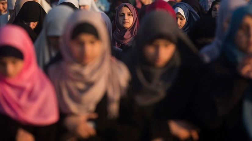 Palestinian women preform at Eid al-Fitr prayers marking the end of the holy fasting month of Ramadan, in Eastern Gaza City. Photo: PTI Minister's hate speech about Muslims liable for prosecution