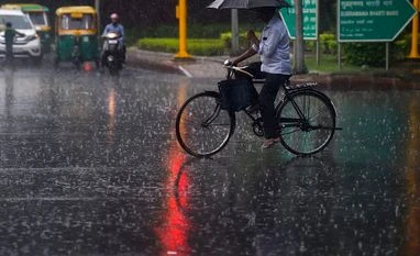 Third party insurance for two, four-wheelers should be mandatory: SC A cyclist crosses a road during monsoon rainfall at Zakir Hussain Marg, in New Delhi