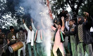 Congress loan waiver promise to farmers proved game changer in Chhattisgarh Congress Party worker celebrate as initial trends show the party leading in the states Assembly elections, at Congress office, in New Delhi