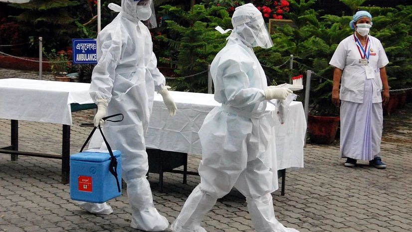 Medics collect Swab sample of COVID-19 patients and walk towards Laboratory at Mahendra Mohan Choudhury Hospital (MMCH), during the ongoing nationwide COVID-19 lockdown in Guwahati on Wednesday. Medics collect Swab sample of COVID-19 patients and walk towards Laboratory at Mahendra Mohan Choudhury Hospital (MMCH), during the ongoing nationwide COVID-19 lockdown in Guwahati on Wednesday.