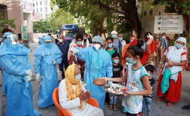 India coronavirus dispatch: Covid patients more prone to dying from surgery An old patient who fought coronavirus being felicitated after his recovery, at Aurbindo hospital.