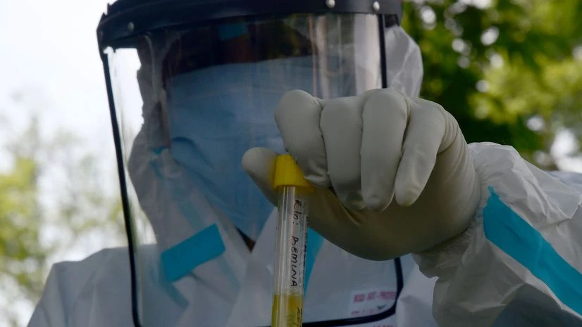 Coronavirus test, Covid-19 test A doctor wearing protective gear holds a sample test tube at COVID-19 test centre during a nationwide lockdown as a preventive measure against the coronavirus, in Srinagar. Photo: ANI