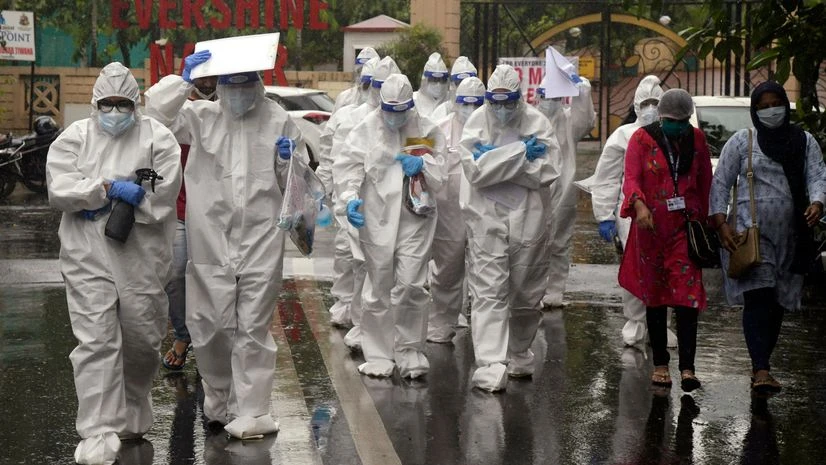 Coronavirus, PPE Medical students of various government hospitals wearing PPE suit going for the thermal screening of people in colonies which are declared as Covid-19 contaminated zones, in Mumbai.