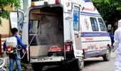 coronavirus, sanitisation, disinfecctant, Worker sprays disinfectant on an ambulance after carrying patients outside a Covid-19 testing centre in Guwahati.