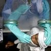 Health worker collects nasal sample from a man for Covid-19 test, at Rajiv Gandhi Super Speciality Hospital in New Delhi.