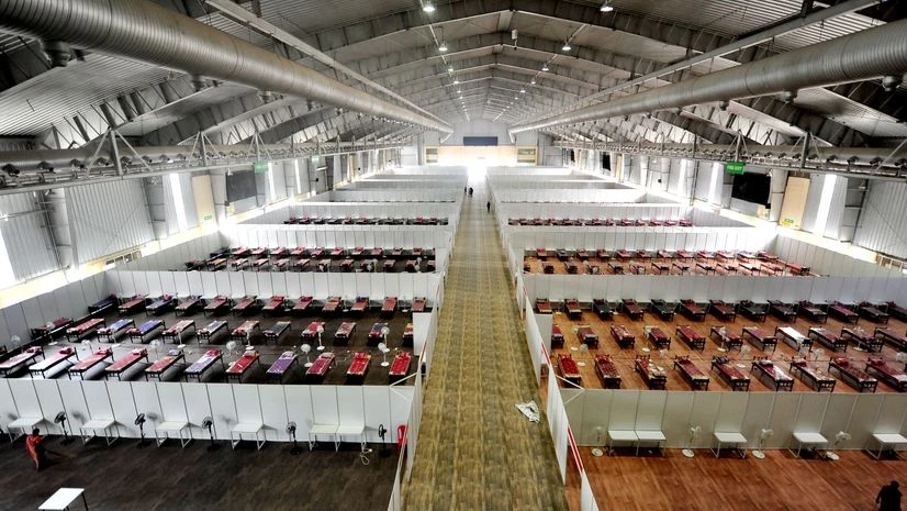coronavirus, beds, hospital, Thousands of beds are seen at a temporary Covid-19 care centre as coronavirus cases rise across the state, at Bengaluru International Exhibition Centre (BIEC), in Bengaluru.