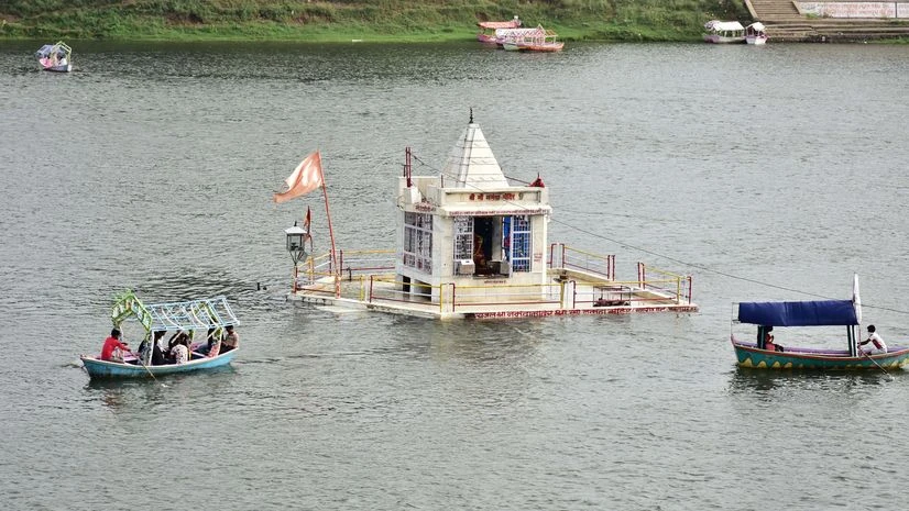 rain, rainfall People take a ride in the boats in the rising water of river Narmada following heavy rainfall, in Jabalpur on Friday. Photo: ANI