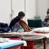 Covid-19 patients are seen inside a quarantine centre at CWG Village, in New Delhi on Thursday. Photo: ANI