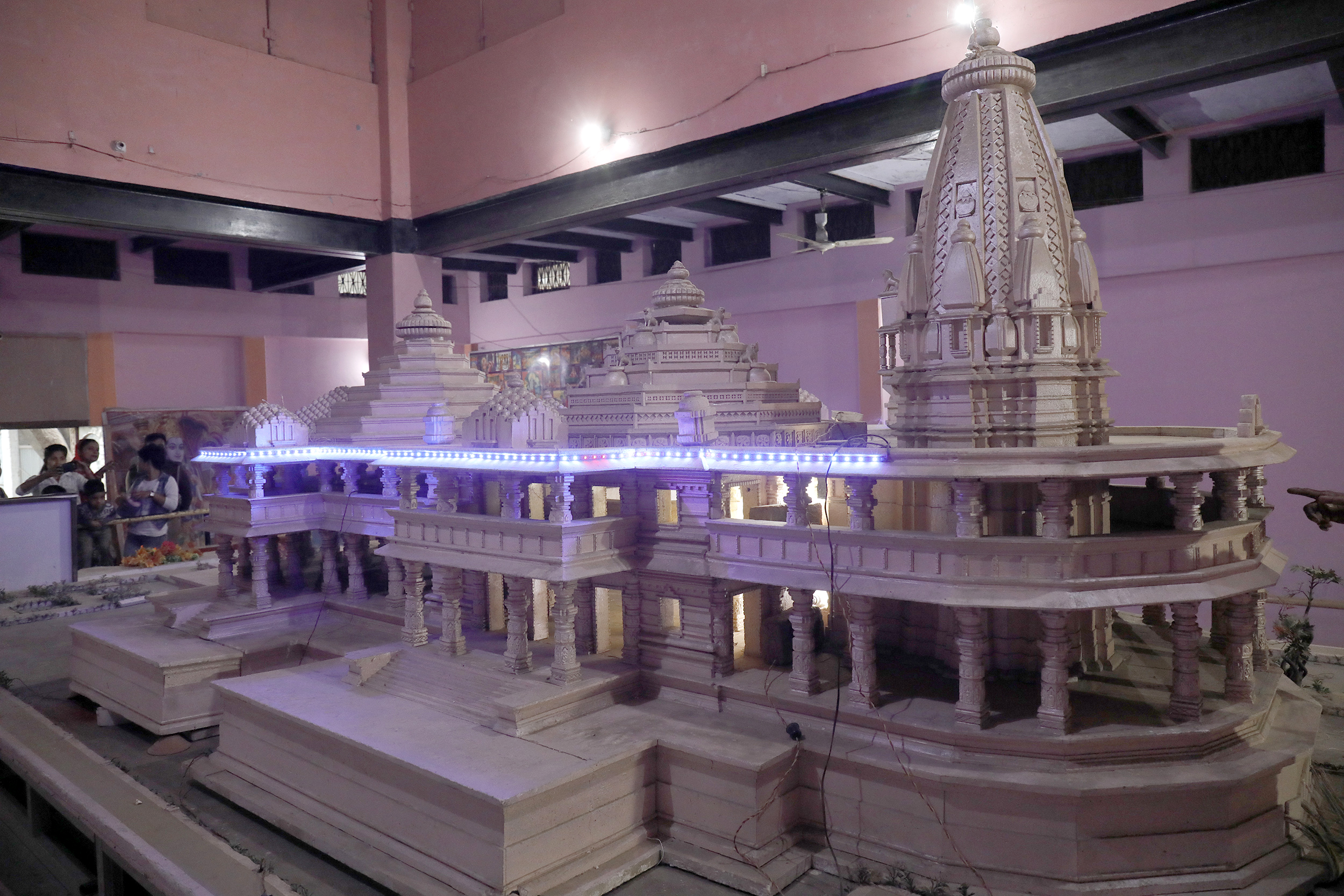 People take a photo of a proposed old model of the Ram Temple kept at Karsewakpuram People take a photo of a proposed old model of the Ram Temple kept at Karsewakpuram