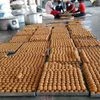 Workers preparing laddoos for Prasadam ahead of foundation laying ceremony of Ram temple, in Ayodhya on Thursday.