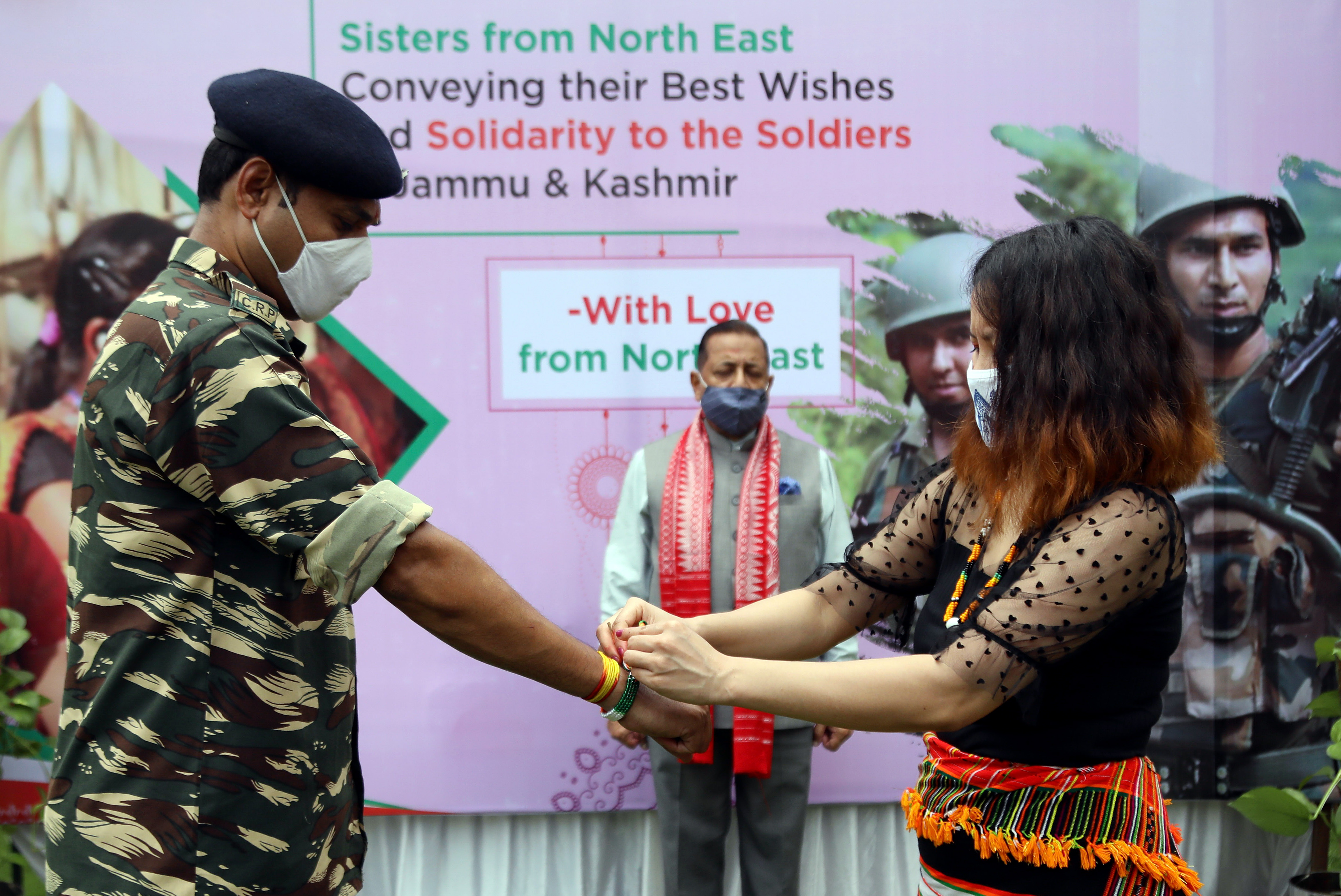 Girls from north eastern states tie Rakhi on soldiers' wrists on the eve of Rakshabandhan festival in New Delhi Girls from north eastern states tie Rakhi on soldiers' wrists on the eve of Rakshabandhan festival in New Delhi