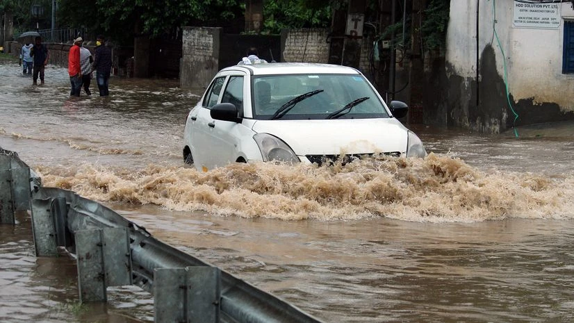 heavy rain A vehicle passing through waterlogged Delhi- Gurugram expressway after heavy rains, at Narsinghpur, in Gurugram on Thursday.