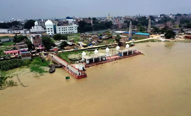 In pictures: States battle floods, warned about landslides Flood