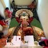 Artists Shruti Shirke (top right) along with her team made (create) a mosaic portrait of Lord Ganesh using paper flower, ahead of upcoming Ganesh festival in Mumbai on Wednesday.
