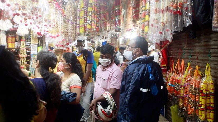 Ganesh Chaturthi People shopping at a market ahead of Ganesh Chaturthi festival in Mumbai on Thursday.