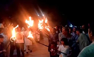 Pakistan occupied Kashmir, PoK People raise slogans "Neelum-Jhelum behne do, humein zinda rehne do" and hold torch rally during a protest to oppose the mega dams to be constructed by Chinese firms on Neelum-Jhelum River, in Muzaffarabad city of Pakistan occupied Kashmir.