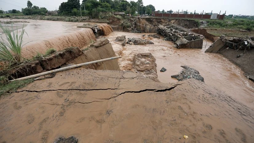Jammu, flood, rainfall, A portion of bridge collapsed and washed away due to heavy rainfall in Jammu on Wednesday.