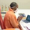 Uttar Pradesh Chief Minister Yogi Adityanath speaks to the family of Hathras gang-rape victim, via video conferencing, in Lucknow.