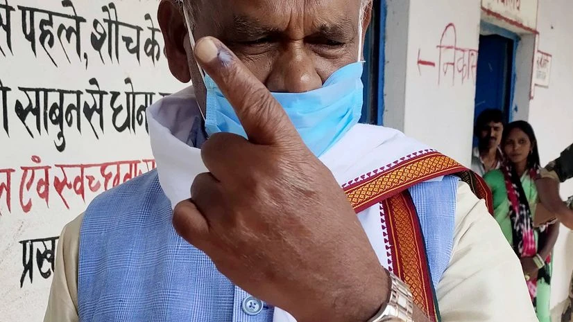 Jitan Ram Manjhi, Bihar Assembly polls HAM (S) president Jitan Ram Manjhi shows her finger marked with indelible ink after cast their vote at Polling station for the first phase Bihar Assembly polls, at Atri in Gaya district on Wednesday.