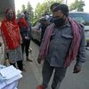 A medic collects details of the people during COVID-19 random testing of the people traveling from Delhi to Noida organized by the administration of Gautam Buddh Nagar, in Noida on Wednesday.