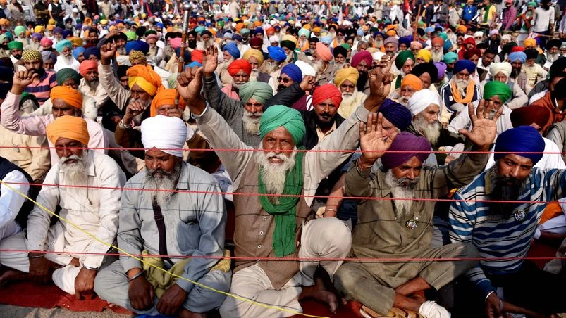 Farmers protest Farmers raise slogans during a protest against the farm laws at Singhu border in New Delhi on Tuesday.