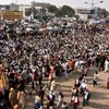 Farmers gathered at Singhu border during their protest against farm laws, in New Delhi on Tuesday.