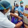 Medic workers conduct a dry run for the COVID-19 vaccination on a beneficiary, at a government hospital in Kolkata on Friday.