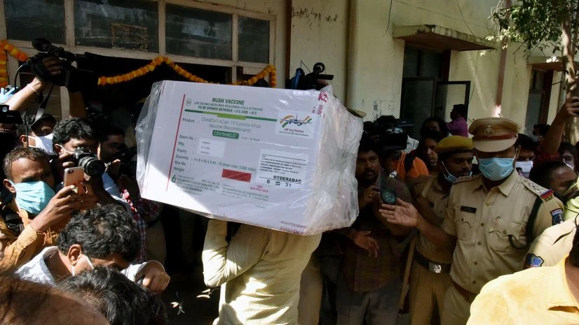 vaccine A worker unloads COVISHIELD vaccine consignment from Serum Institute of India as it arrives at the State Vaccine Store, ahead of the rollout of the vaccination program, in Hyderabad on Tuesday.