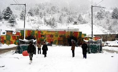 Intense cold grips Kashmir, Srinagar records minus 8.8 degree Celsius temp A view of Jawhar tunnel at Qazigund south Kashmir during fresh snowfall