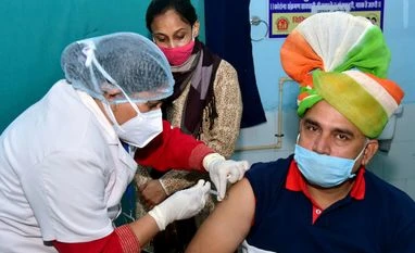 Covid-19: India records 12,408 new cases, 120 fresh fatalities in 24 hrs Beneficiary gets a Covid-19 vaccine at City Dispensary, in Bikaner