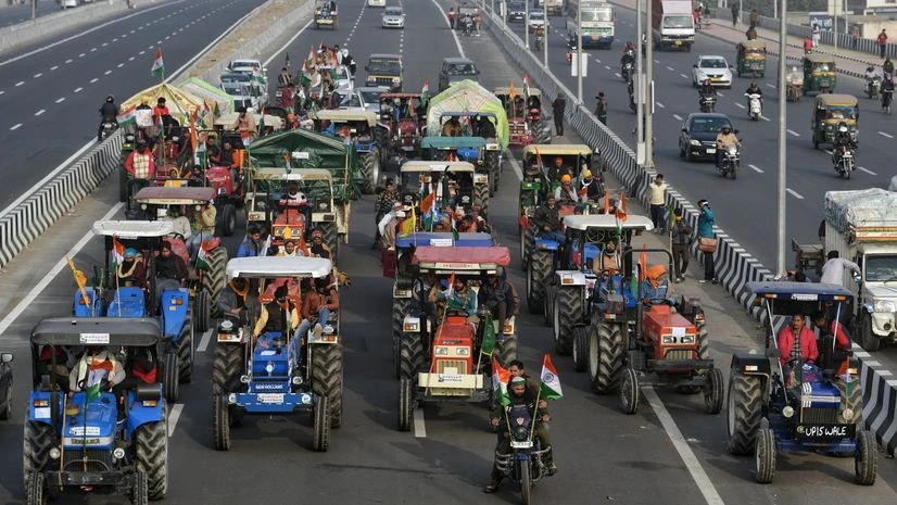 Opposition slams govt in Lok Sabha for ignoring 'aam admi' in Budget Farmers ride a tractors during their protest against farm laws at Ghazipur border in New Delhi