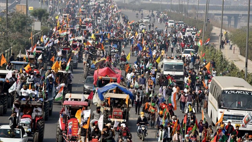 Protesting farmers' during their Tractor rally against the new farm laws at Outer Ring Road near Mukarba Chowk in New Delhi Protesting farmers' during their Tractor rally against the new farm laws at Outer Ring Road near Mukarba Chowk in New Delhi