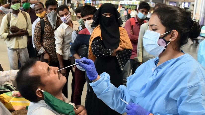 Covid-19 test A health worker collects a nasal swab of a passenger for COVID-19 testing at Chhatrapati Shivaji Maharaj Terminal, in Mumbai on Tuesday.