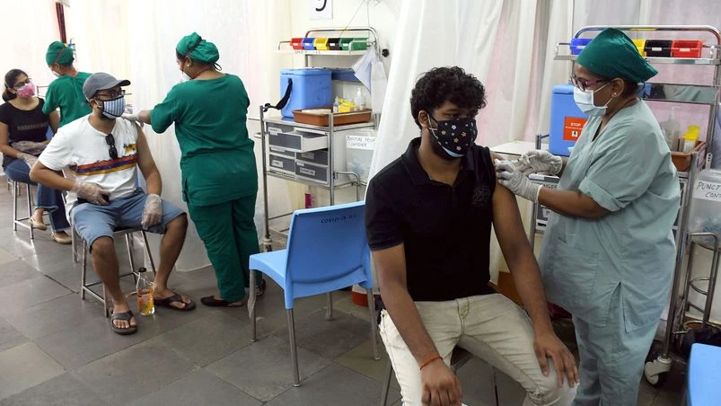 Medics inoculate doses of COVID-19 vaccine to people during the third phase of the vaccination drive, at BKC Jumbo Covid Centre in Mumbai on Saturday. COVID-19 vaccination drive for people above 18 years has begun. Medics inoculate doses of COVID-19 vaccine to people during the third phase of the vaccination drive, at BKC Jumbo Covid Centre in Mumbai on Saturday. COVID-19 vaccination drive for people above 18 years has begun.