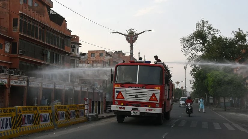 coronavirus Fire Fighters sprays disinfection at Johri Bazar area during corona curfew, in Jaipur on Sunday.