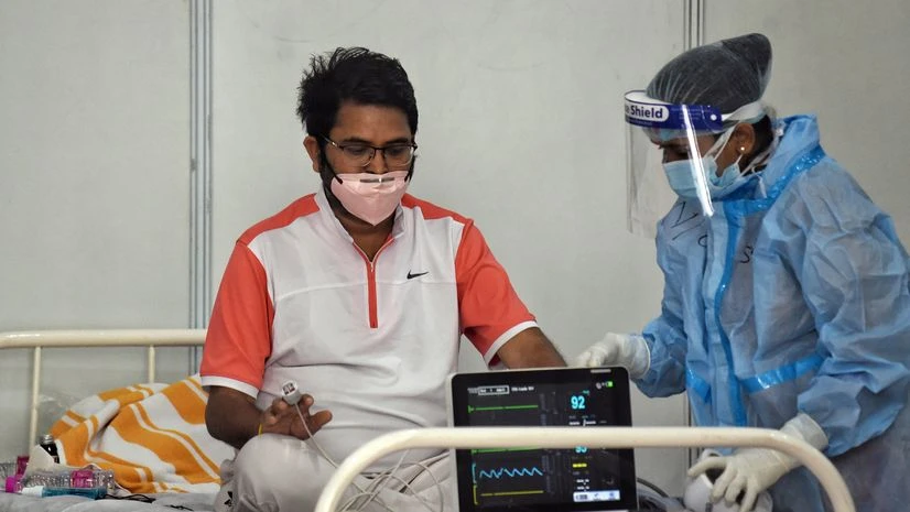 Covid patient, coronavirus patient A COVID19 patient during treatment at COVID19 care centre in New Delhi on Thursday.