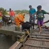 Villagers along with their cattle ride on a boat to move toward a safer place after the cyclone Yaas,  in Gosaba village in  Sundarban on Thursday.