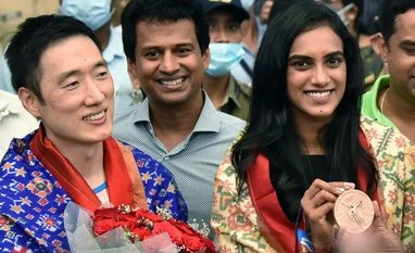Tokyo bronze medallist Sindhu arrives to a rousing welcome in Hyderabad Olympic medallist PV Sindhu and her coach Park Tae Sang arrive at Rajiv Gandhi International Airport, in Hyderabad on Wednesday.