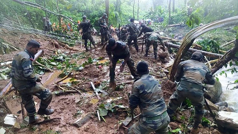Kerala flood Army personnel clear the debris caused by a landslide at a flood-affected area, at Kavali village, in Kottayam. Photo: ANI