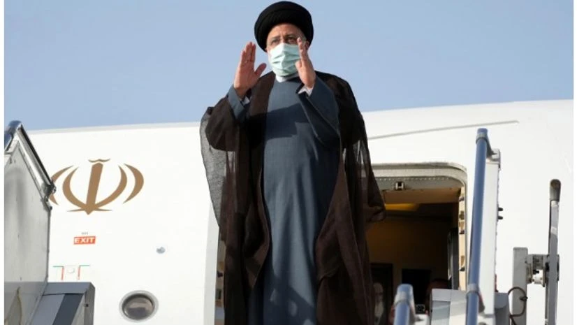 Ebrahim Raisi Iranian President Ebrahim Raisi waves to media and officials as he boards his plane departing Tehran's Mehrabad airport for a trip to Oman, Monday, May, 23, 2022. AP/PTI