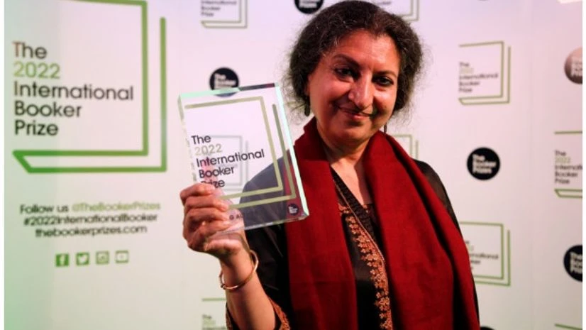Geetanjali Shree Author Geetanjali Shree poses with the 2022 International Booker Prize award for her novel 'Tomb of Sand' in London, Thursday, May 26, 2022. AP/PTI(