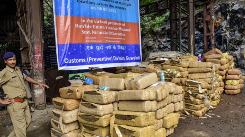 Drugs Destruction Day Guwahati: A police personnel prepares seized narcotics and psychotropic substances for their incineration, in the virtual presence of Finance Minister Nirmala Sitharaman, on the occasion of 'Drugs Destruction Day', in Guwahati, Wednesday, June 8, 202