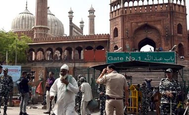 Two men arrested in protest near Jama Masjid against Prophet remark Paramilitary and police personnel stand guard during a protest over alleged remarks by suspended BJP leader Nupur Sharma and expelled leader Naveen Jindal, at Jama Masjid, in New Delhi on Friday.