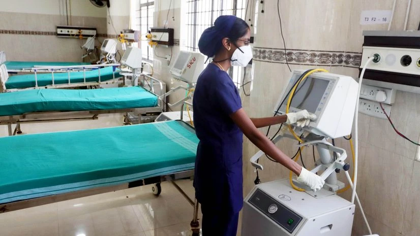 coronavirus A healthcare worker prepares a COVID-19 ward in view of the rising coronavirus cases, at a government hospital, in Chennai.