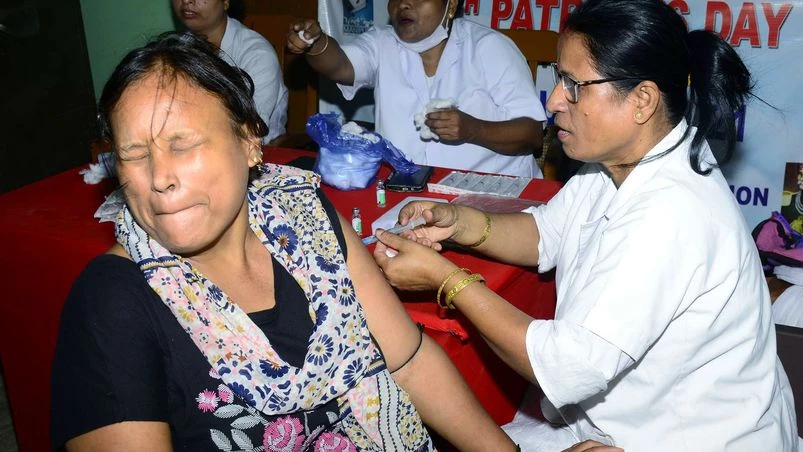 Covid, coronavirus, vaccination A healthcare worker administers a booster dose of COVID-19 vaccine to a beneficiary, in Guwahati.