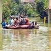 Residents oResidents of a locality being ferried by firefighters after the area partially submerged following incessant f a locality being ferried by firefighters after the area partially submerged following incessant rain, in Bengaluru on Tuesday.